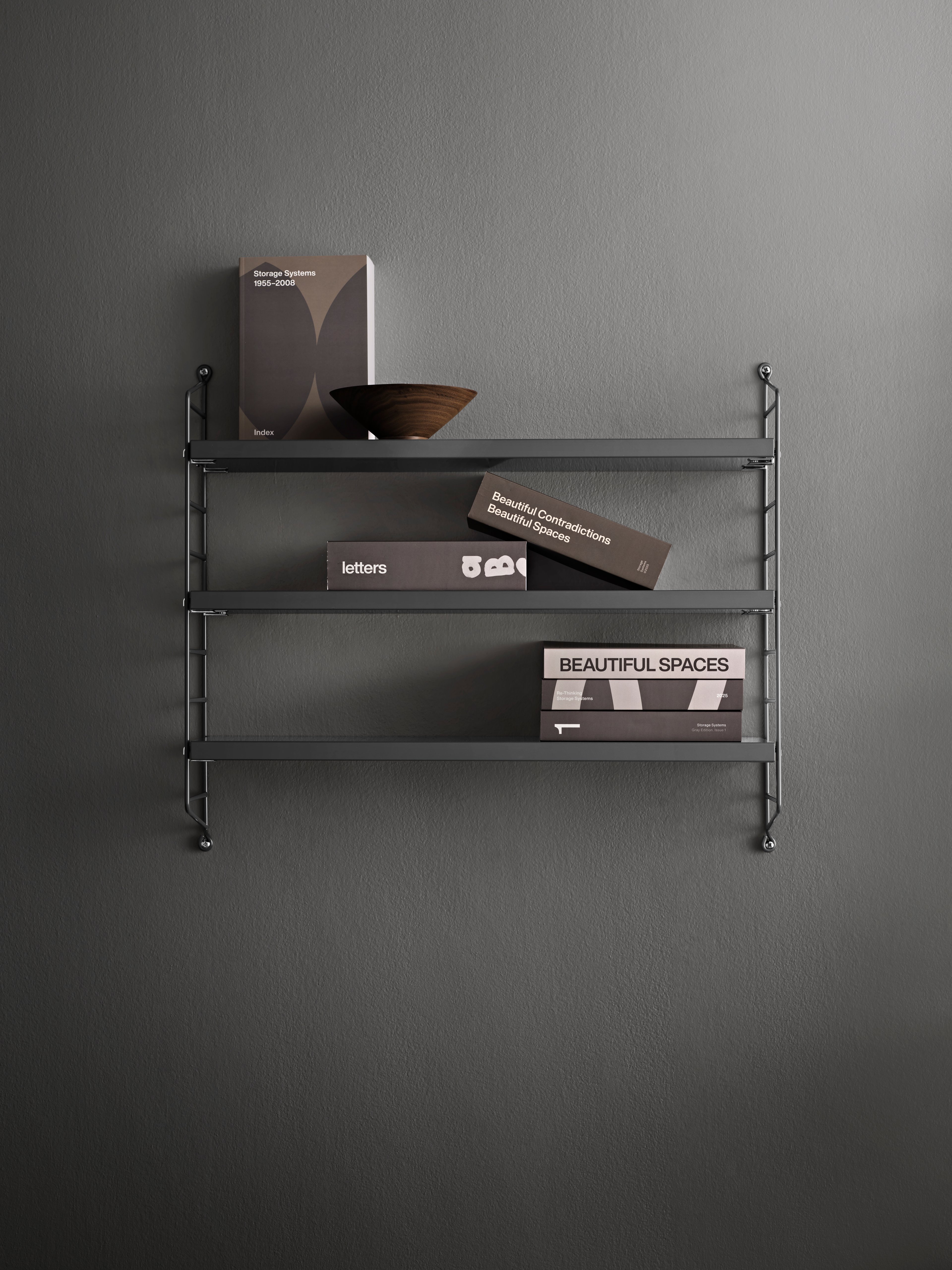 String® Pocket is sold as a complete shelf but is equally flexible as String® System. String® Pocket invites creativity and personality where you can combine two or three String® Pocket shelves into one larger shelf. Mix and match different colours and wooden alternatives to suit your style and preferences. Since the shelf is neat and practical it fits equally well as a nightstand as an extra shelf in your hallway. String® Pocket is sold as one complete unit containing two wire panels, height 50 cm, and three shelves, width 58 cm and depth 15 cm.