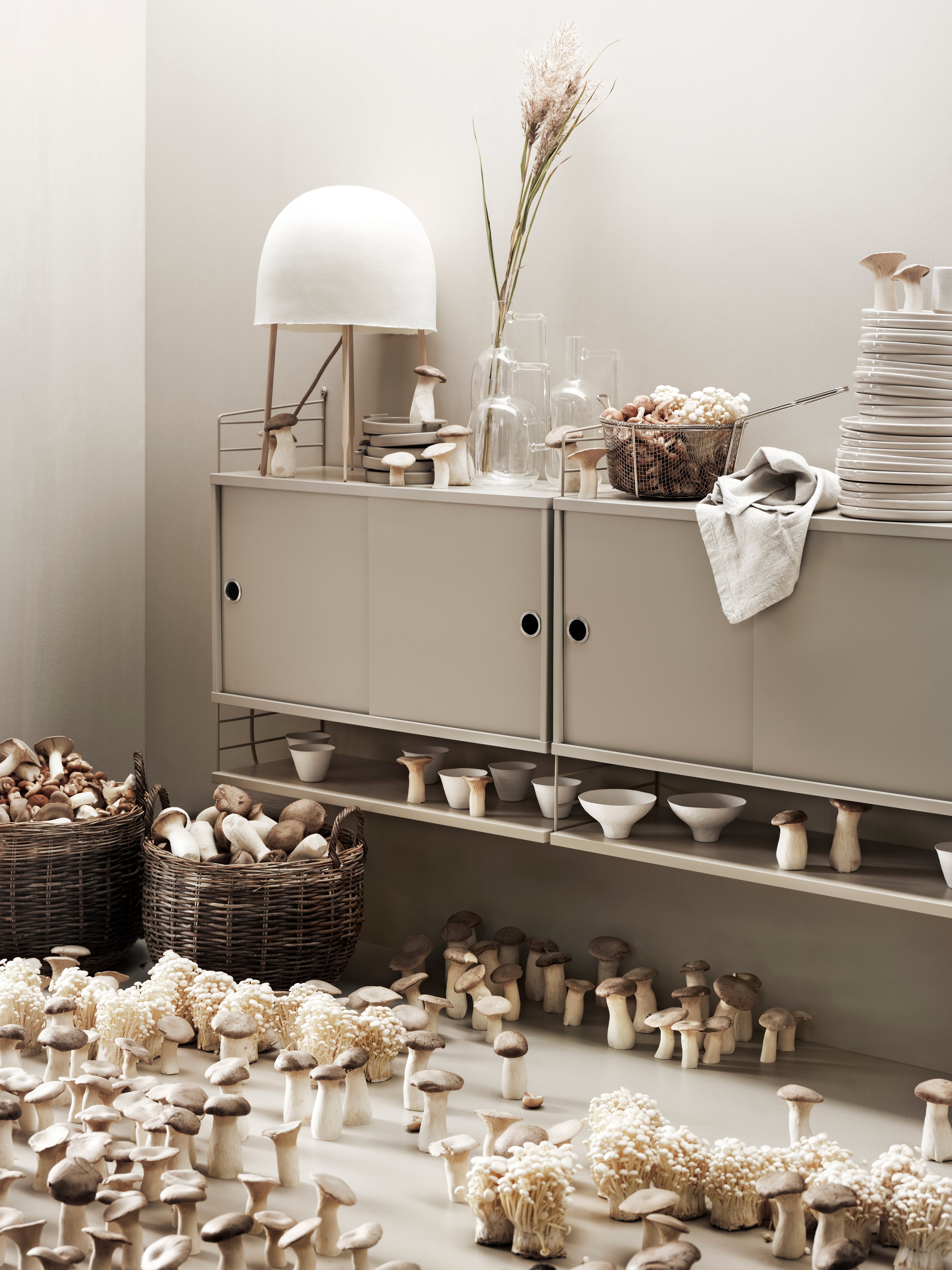 The cabinets with sliding doors are available in one width, 78 cm, along with two depths, 20 and 30 cm. The cabinets fit into all wire and plex panels from String® System. It is visually pleasing to add a bolder element to your shelf, like a cabinet, which also give you a lot of extra storage. The cabinet consists of one divider placed in the middle along with two adjustable inner shelves. The cabinet’s inner dimensions are 4 cm less than the outer dimensions. The cabinets are delivered unassembled.