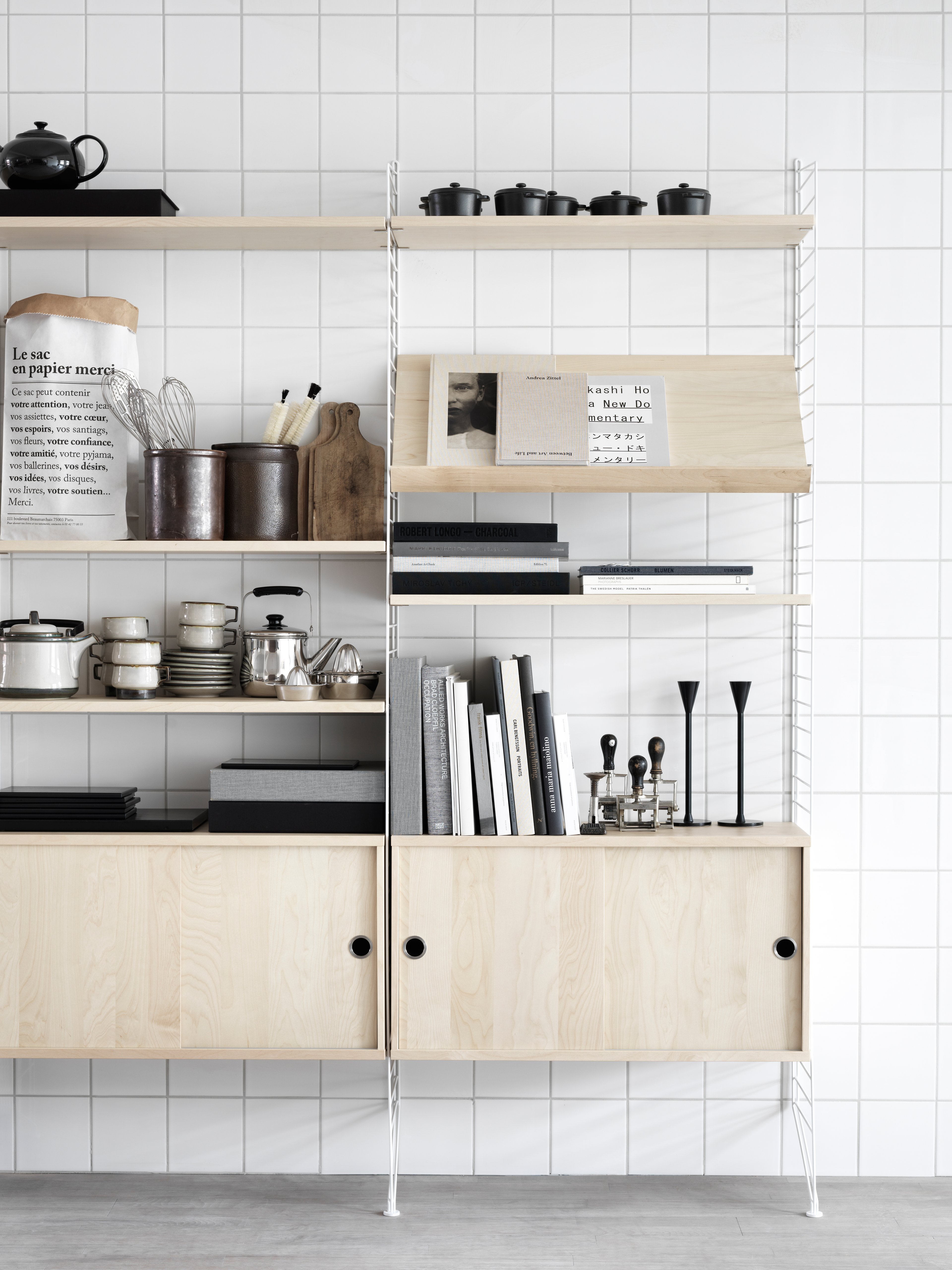 The cabinets with sliding doors are available in one width, 78 cm, along with two depths, 20 and 30 cm. The cabinets fit into all wire and plex panels from String® System. It is visually pleasing to add a bolder element to your shelf, like a cabinet, which also give you a lot of extra storage. The cabinet consists of one divider placed in the middle along with two adjustable inner shelves. The cabinet’s inner dimensions are 4 cm less than the outer dimensions. The cabinets are delivered unassembled.