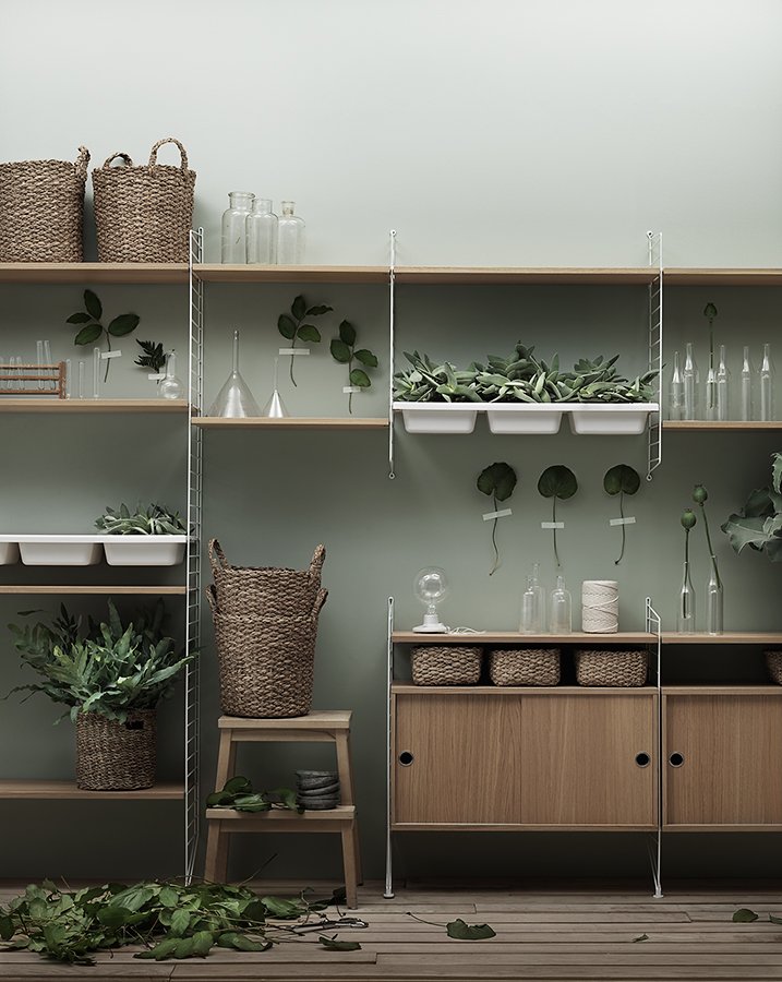 The cabinets with sliding doors are available in one width, 78 cm, along with two depths, 20 and 30 cm. The cabinets fit into all wire and plex panels from String® System. It is visually pleasing to add a bolder element to your shelf, like a cabinet, which also give you a lot of extra storage. The cabinet consists of one divider placed in the middle along with two adjustable inner shelves. The cabinet’s inner dimensions are 4 cm less than the outer dimensions. The cabinets are delivered unassembled.